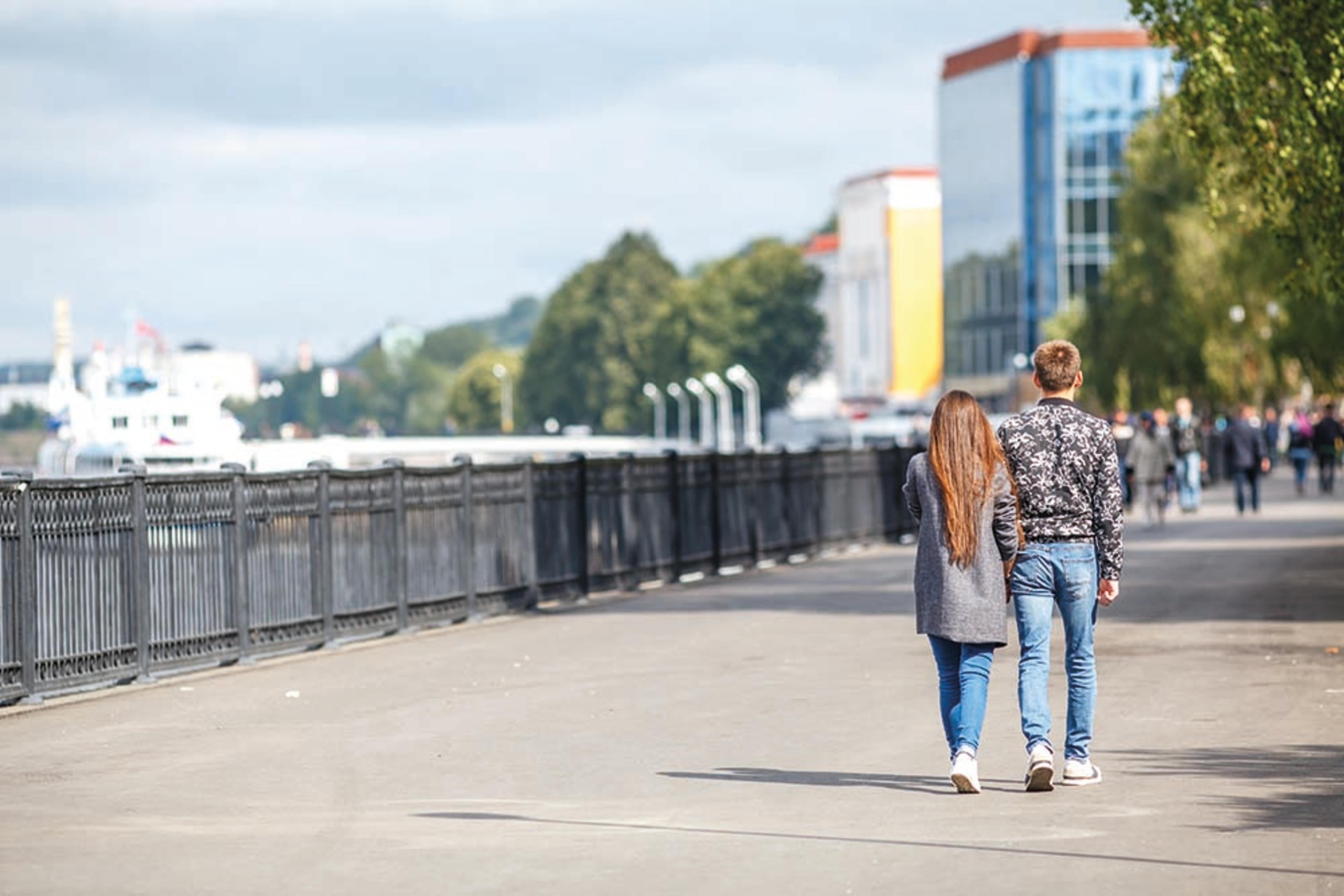 Couple walking along waterfront