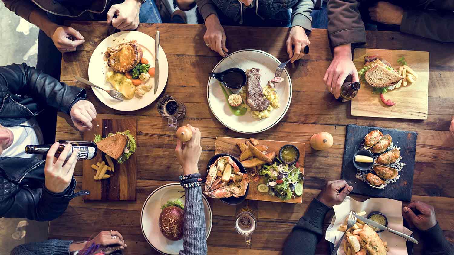 Birds eye view of people sat around a dining table