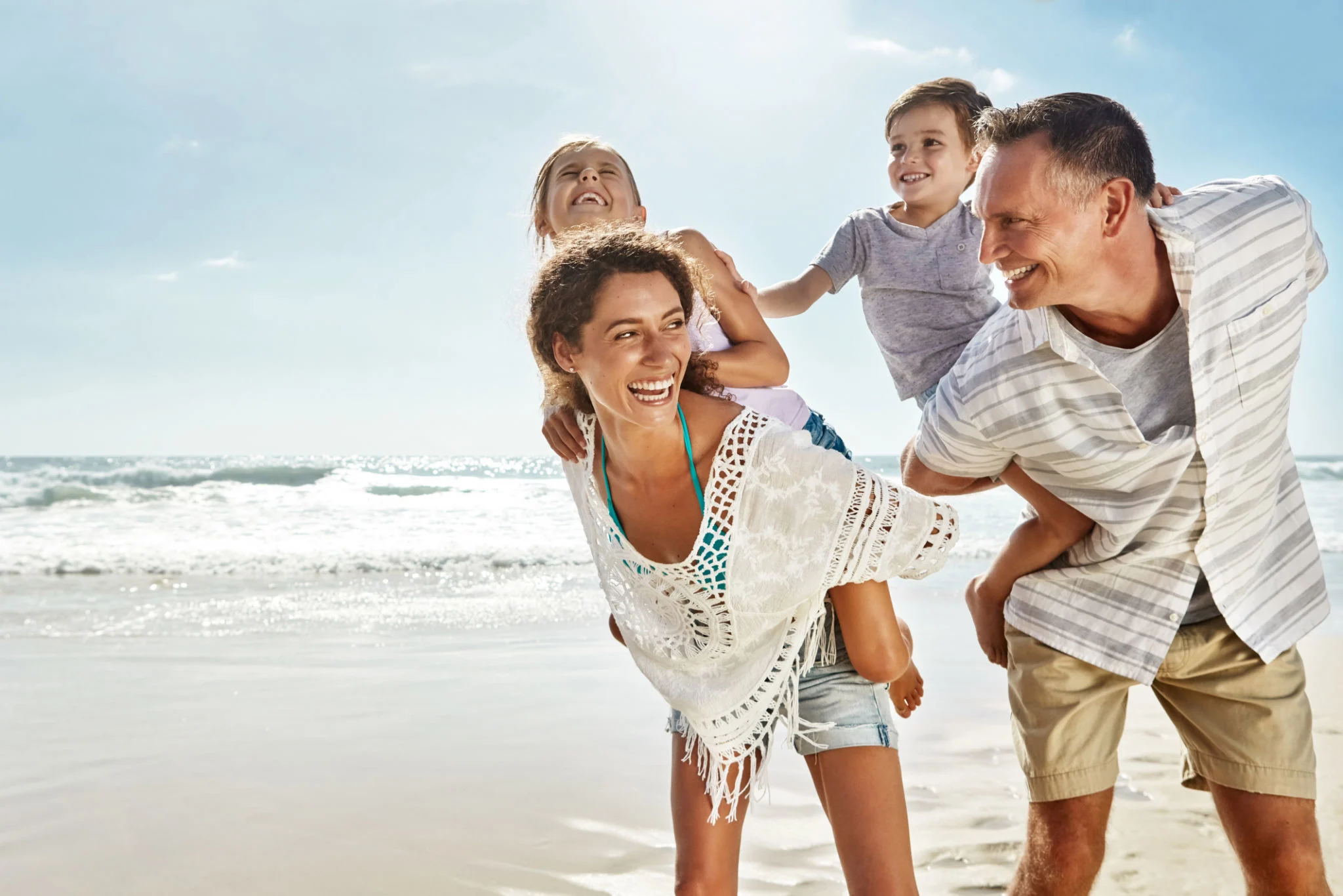 family enjoying beach
