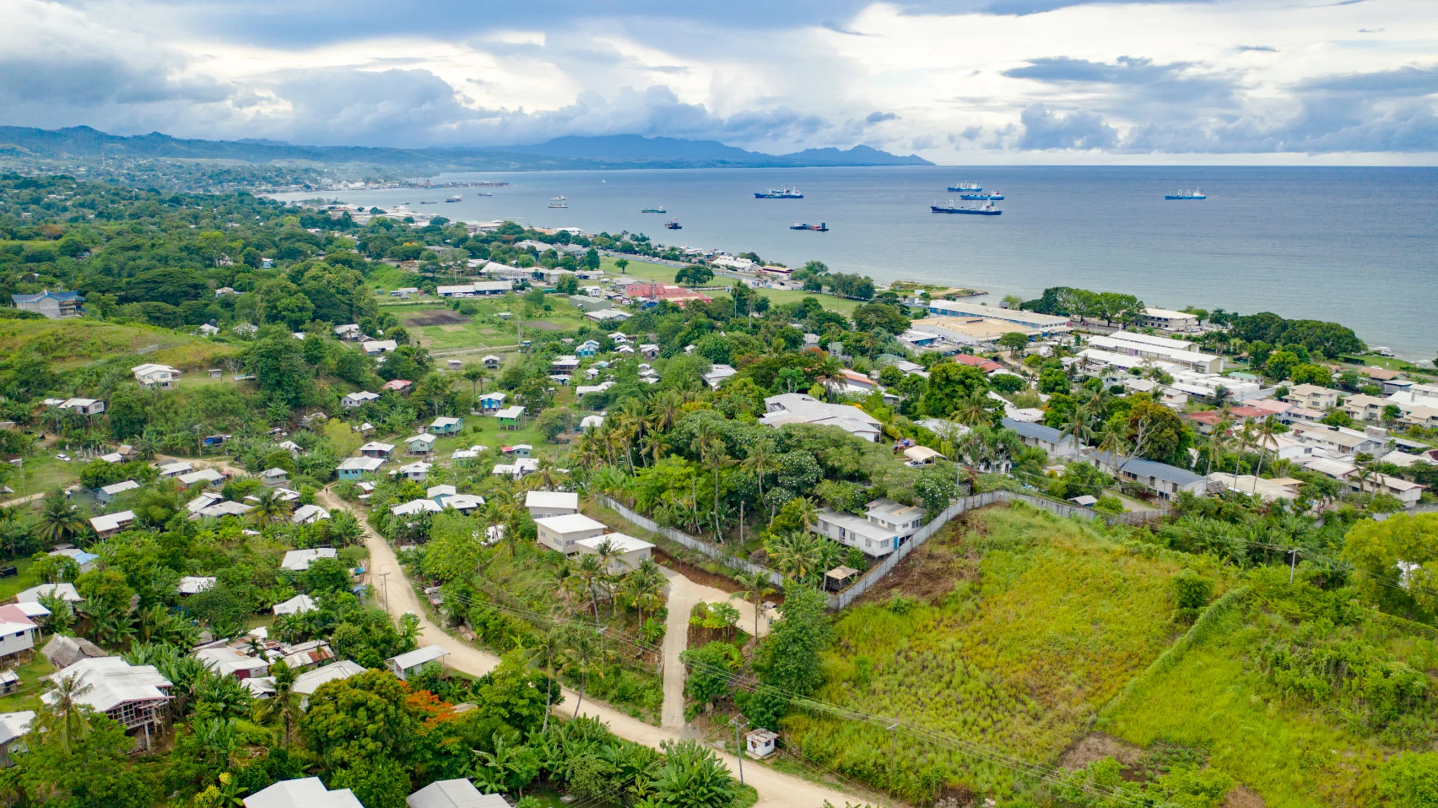 a-suburb-in-honiara-with-ships-and-boats-anchored-in-the-harbour.jpg