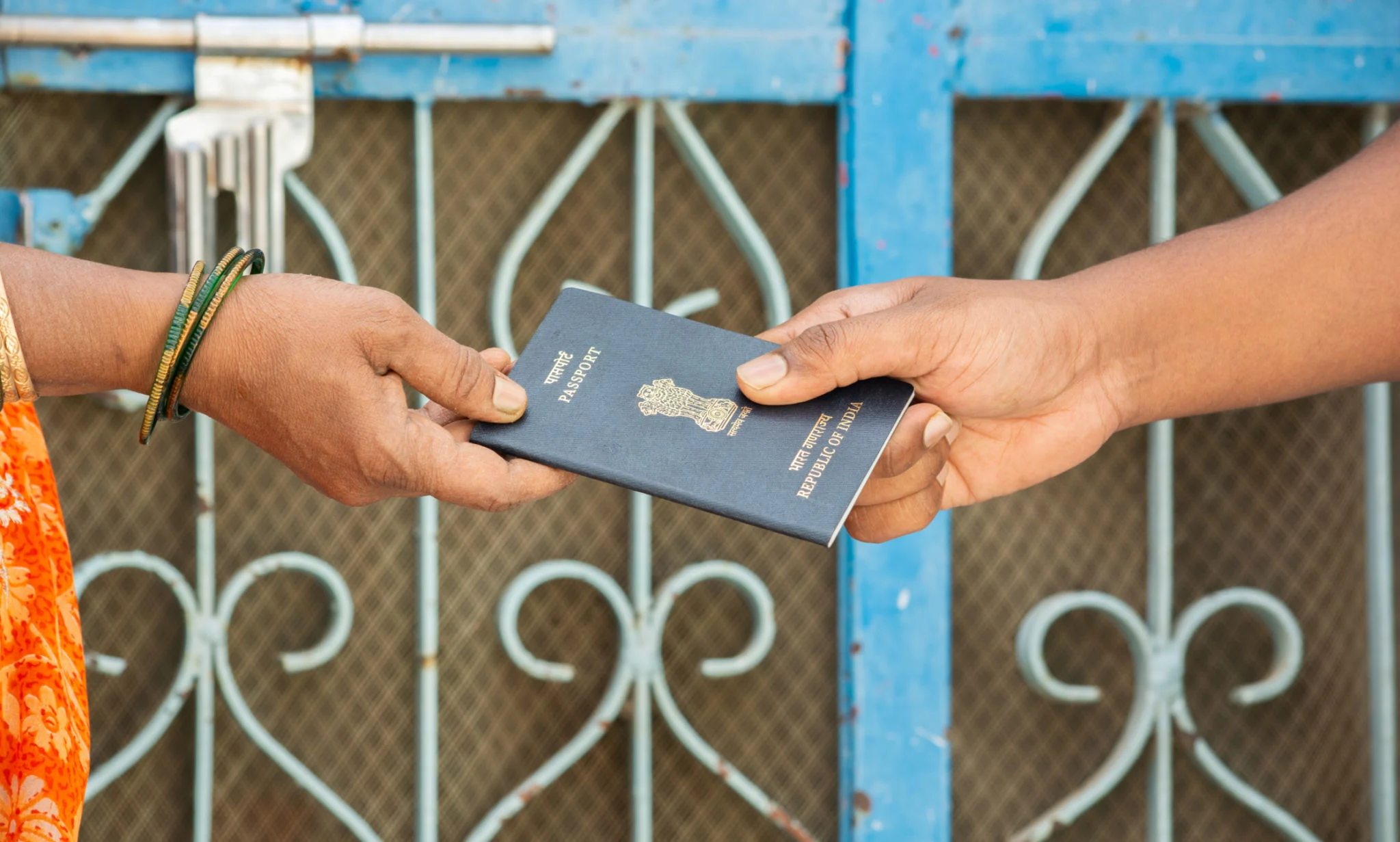 concept-of-women-receiving-passport-at-the-door-step-of-the-house-in-india.jpg