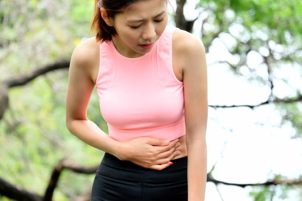 what causes abdominal pain below the belly button