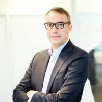 Senior woman wearing a suit (top block)