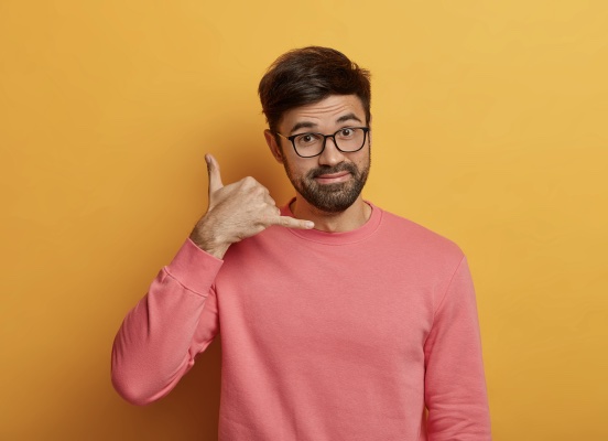 Man doing a phone call sign (CTA)