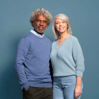 Senior couple looking at camera (small card)