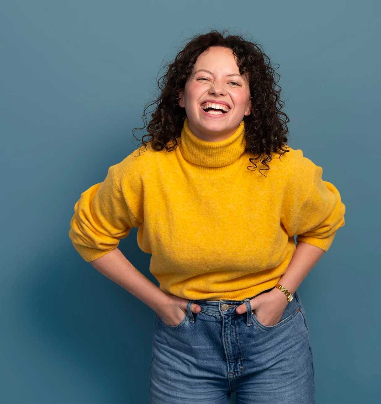 Young woman laughing at camera (top block)