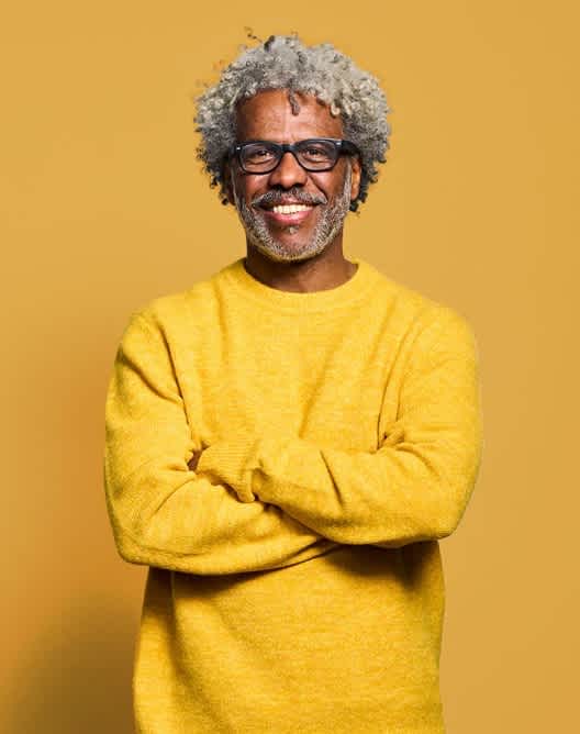 Senior man in yellow sweater (large card - 4col)