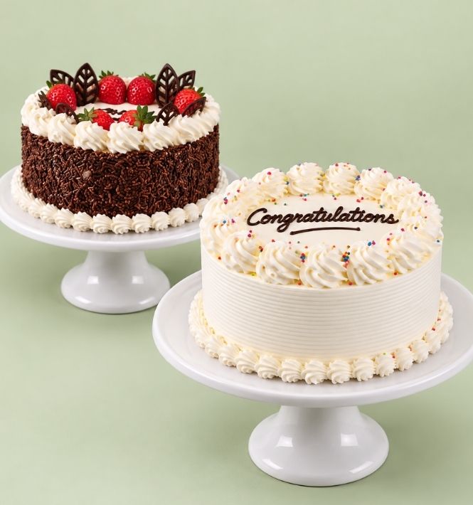 White Congratulations cake with a chocolate and strawberry cake on a pale sage background.