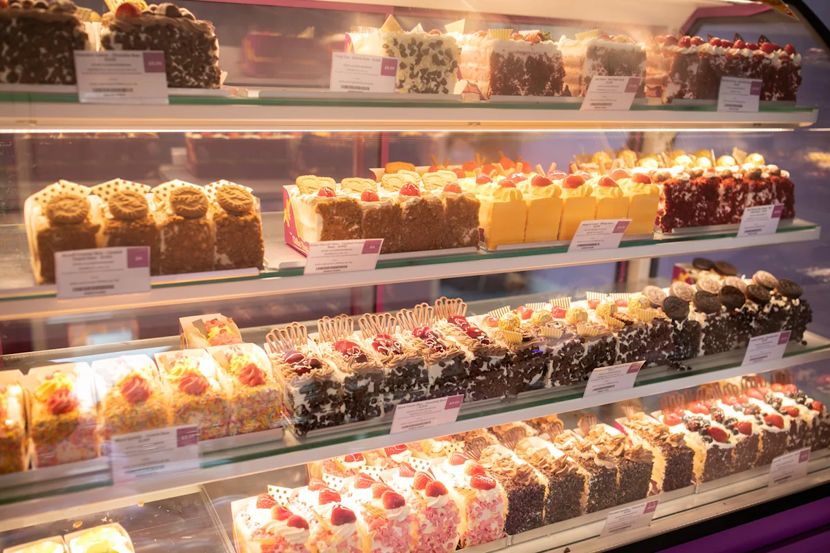 Customers being served at a Cake Box store