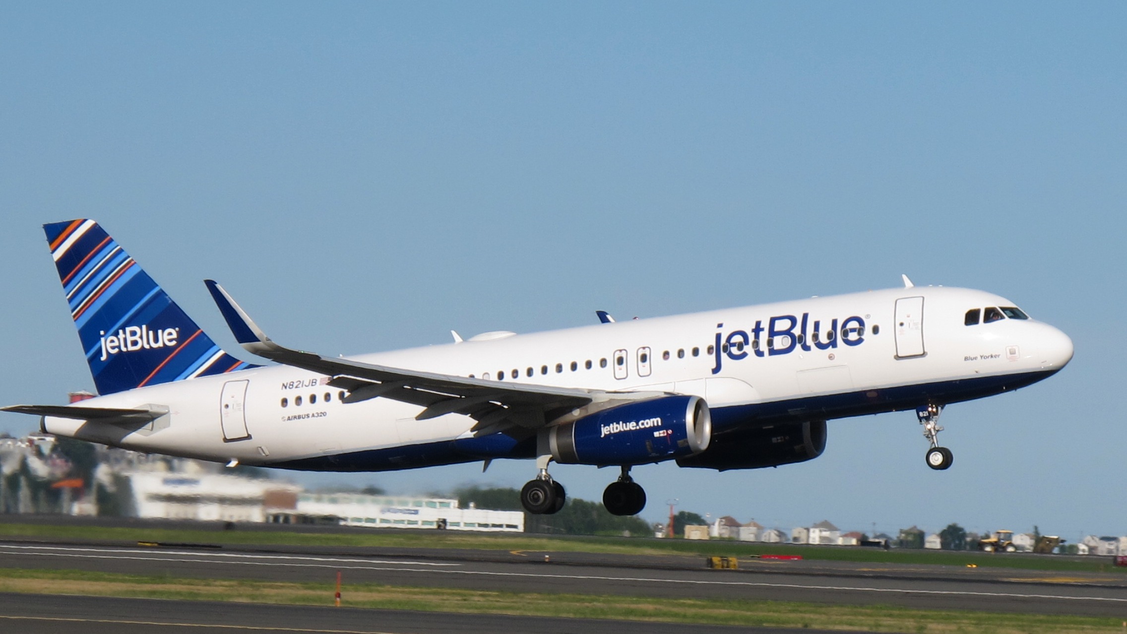 A JetBlue AirBus 320 plane taking off. Courtesy of JetBlue. 