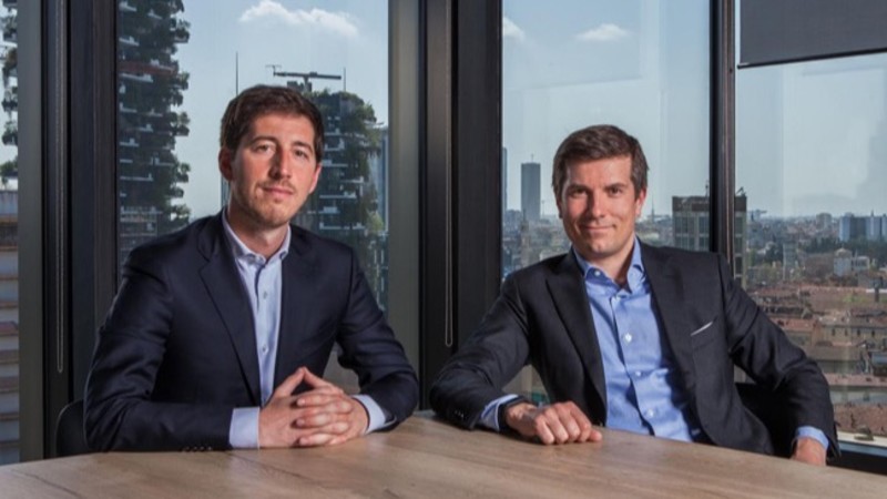 pariters members Matteo Elli and Jari Ognibeni sitting at table