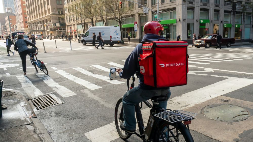 A DoorDash delivery being made in New York City. Editorial Credit: rblfmr, Shutterstock.