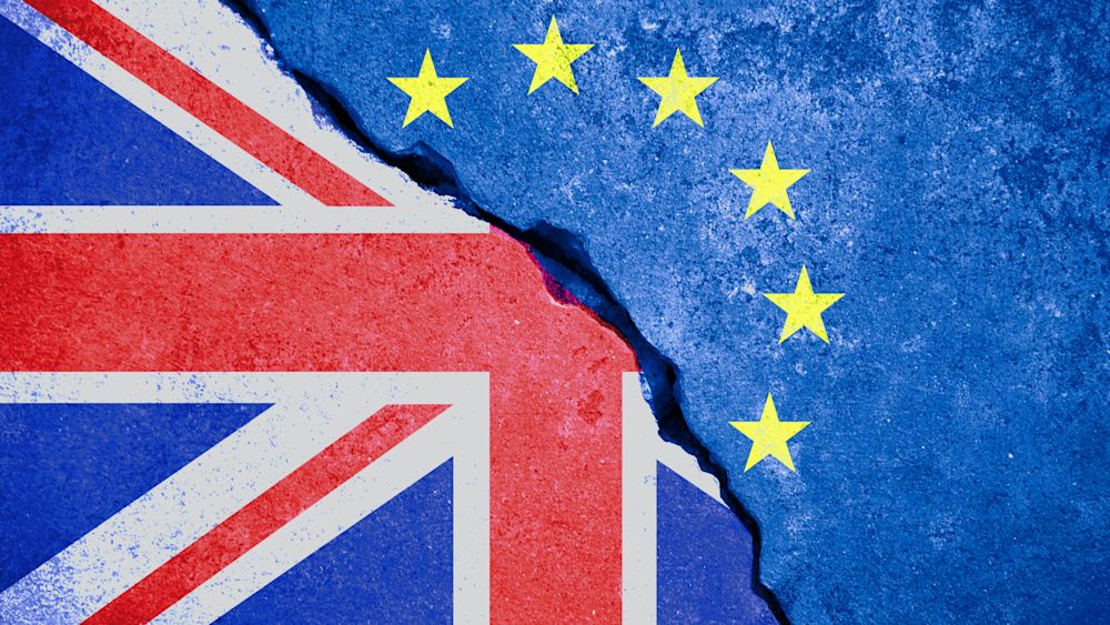Brexit illustration featuring the EU flag and half of the Great Britain flag. Editorial Credit: donfiore, Shutterstock.