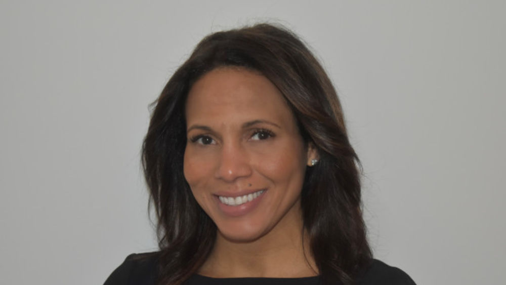 Headshot of Jaime Wynn. Image Source: WWD.