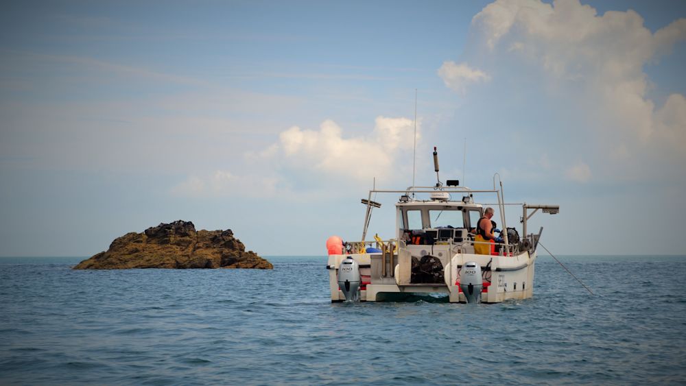A fisherman aboard the FV Mayhem II off the port of Salcombe in the southern UK. Courtesy of South Devon & Channel Shellfishermen's Association.