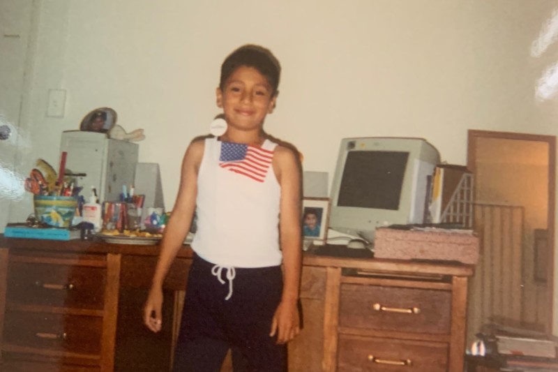 Josue with computer as a child