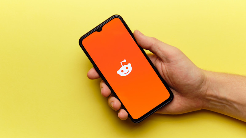 Reddit logo on a phone