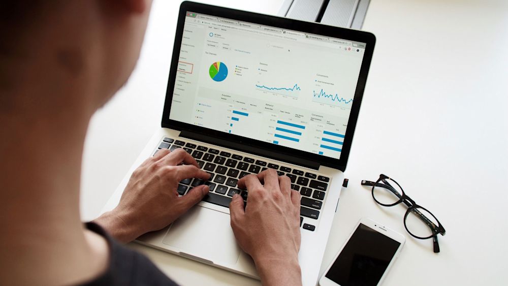 Data Analyst looking at an analytics dashboard