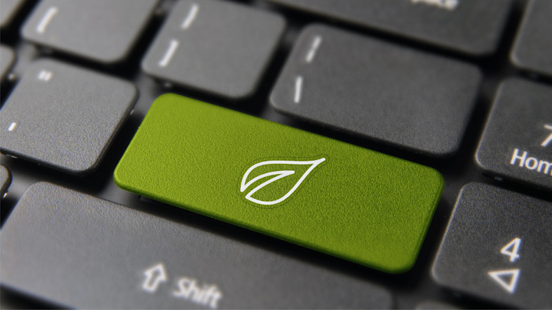 Green energy button on computer keyboard