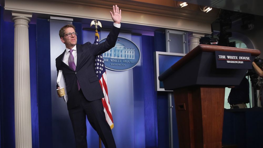 Jay Carney waves at the end of his last White House briefing at the James Brady Press Briefing Room of the White House June 18, 2014 in Washington, D.C.(Photo by Alex Wong/Getty Images)