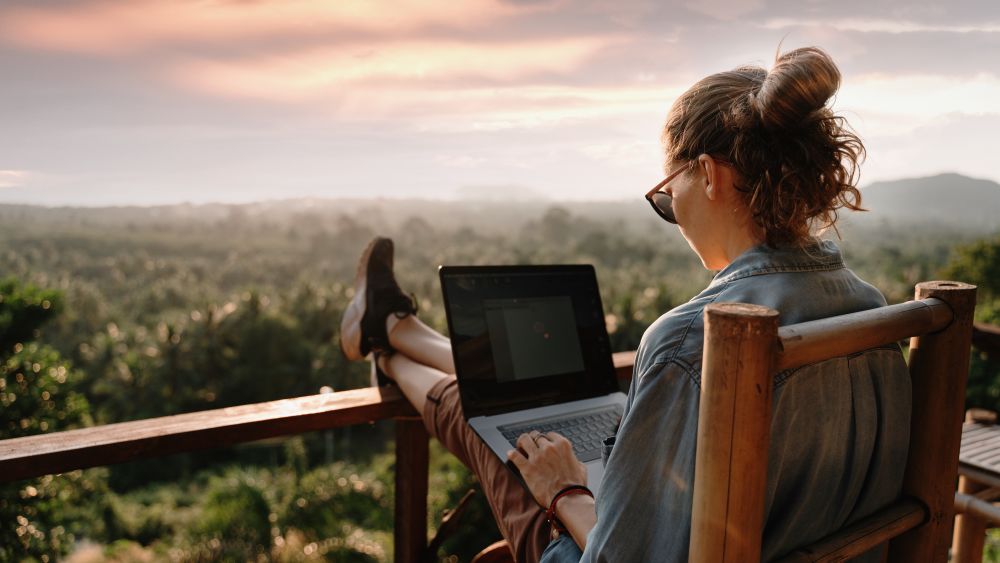 Woman working remotely. Image courtesy of Olesya Kuznetsova via Shutterstock.