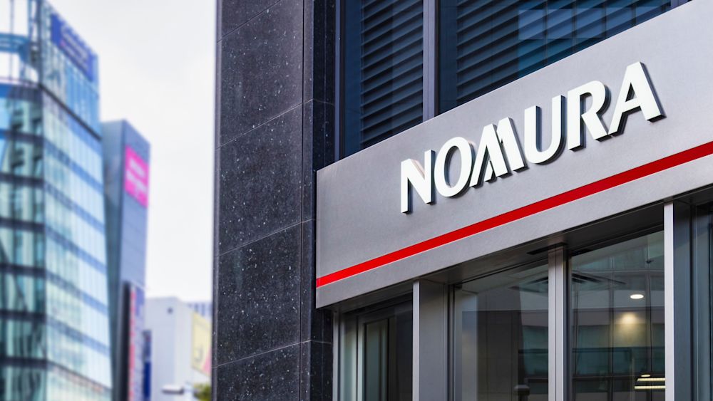 Outside of Nomura Holdings' headquarters in the Nihonbashi district in Tokyo, Japan. Editorial credit: VTT Studio / Shutterstock.com