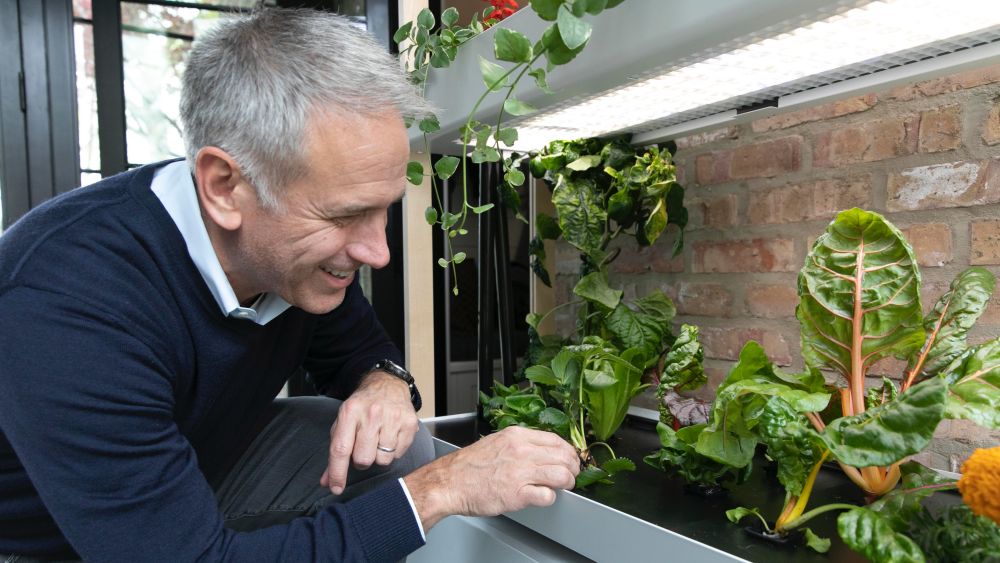 Hank Adams next to a Rise Gardens product. Image credit: Hank Adams (Rise Gardens)