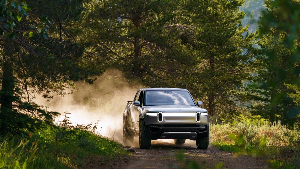 The Rivian R1T being driven in the woods. Courtesy of Rivian.