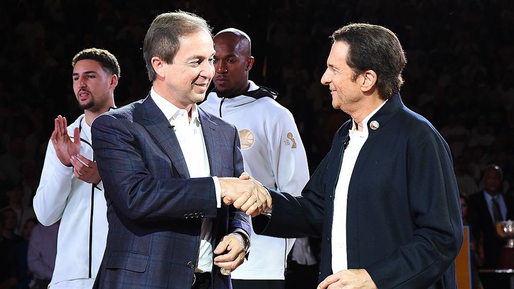 The co-executive chairman of the Golden State Warriors, Joe Lacob and Peter Guber, at a 2017 championship ring ceremony. Courtesy of nba.com.