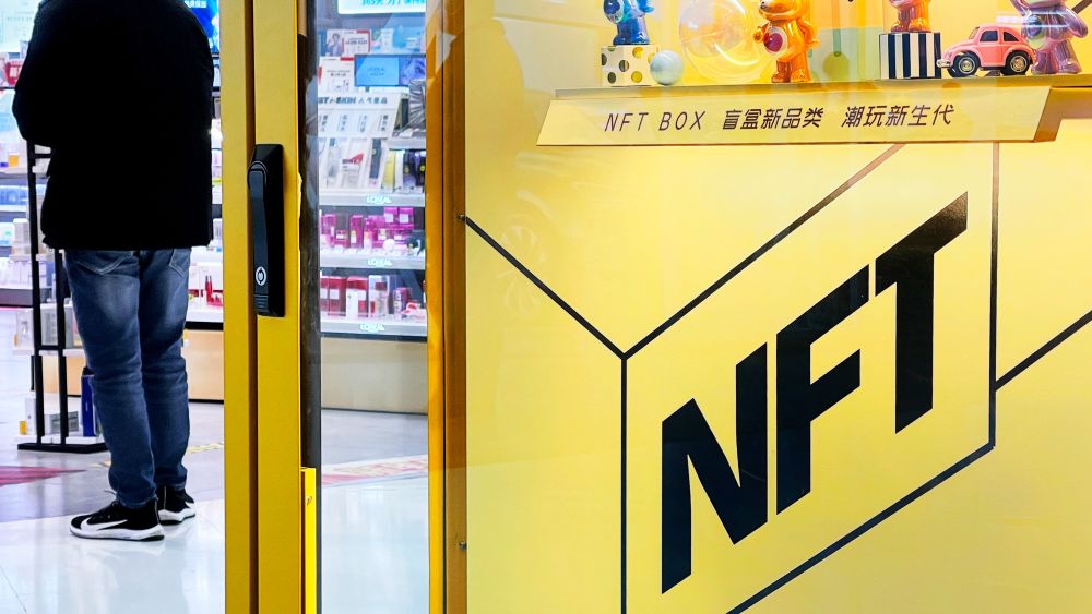 Products of metaverse NFT digital collection are on display in an IP Station unmanned blind box retail machine in a shopping mall on January 23, 2022 in Beijing, China. Image courtesy of Getty Images.