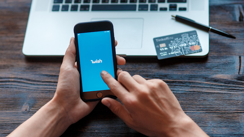 customer using the wish e-commerce app on a mobile phone