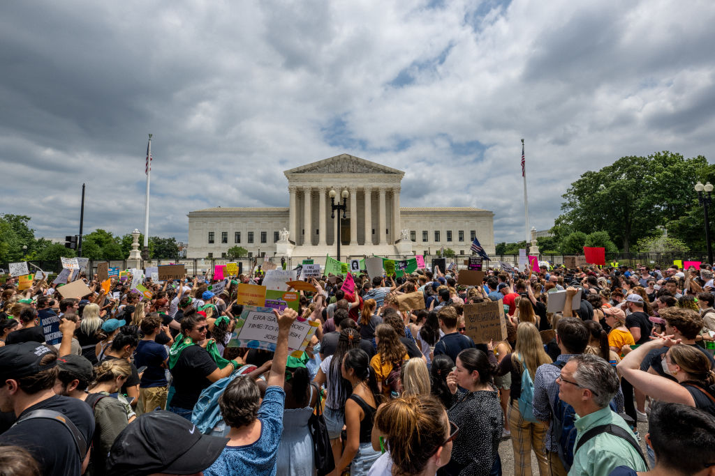 People protest in response to the Dobbs v Jackson Women's Health Organization ruling in front of the U.S. Supreme Court on June 24, 2022 in Washington, DC. The Court's decision overturned the landmark 50-year-old Roe v Wade case and erased a federal right to an abortion. (Photo by Brandon Bell/Getty Images)
