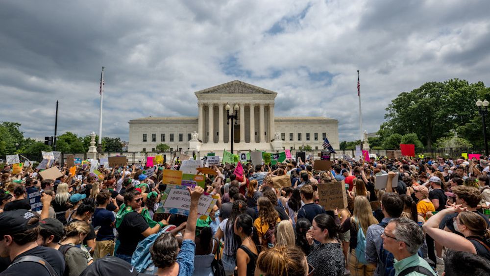 People protest in response to the Dobbs v Jackson Women's Health Organization ruling in front of the U.S. Supreme Court on June 24, 2022 in Washington, DC. The Court's decision overturned the landmark 50-year-old Roe v Wade case and erased a federal right to an abortion. (Photo by Brandon Bell/Getty Images)
