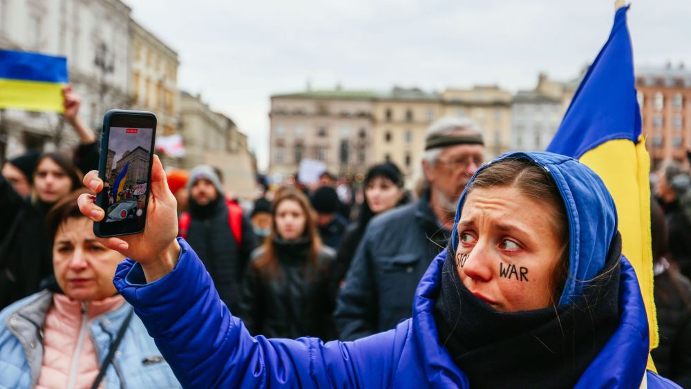 Protester streams live video of demonstration using her smartphone. Getty Images.