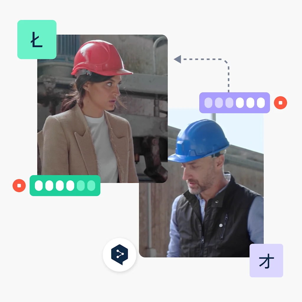 Photo d'une femme et d'un homme sur un chantier de construction, en train de communiquer en polonais et en japonais.