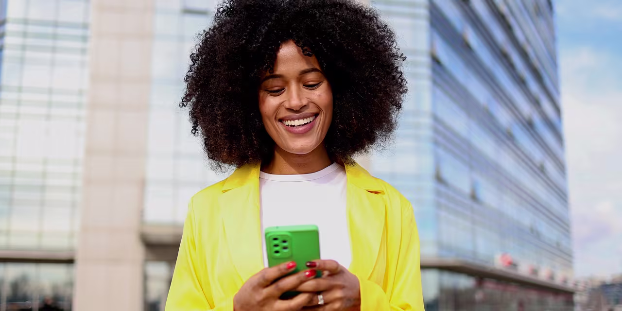 Woman using international Sendwave Digital Money Transfer Wallet