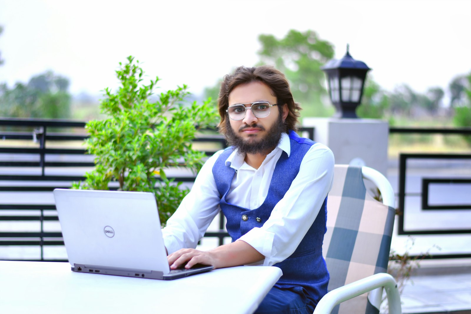 Startup founder working on laptop with automation software, exploring the best geo automation tools for content scaling and SEO growth