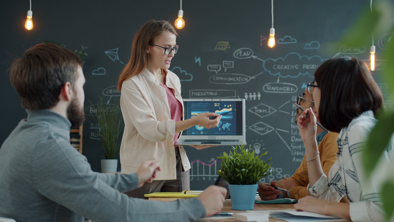 Marketing directors reviewing cited-newsletter strategy documents with AI search optimization charts and competitor analysis on conference table