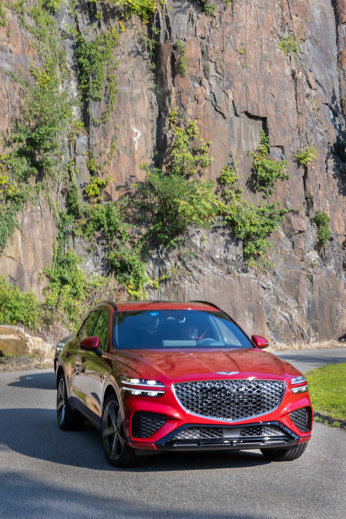 a Genesis GV70 parked near rocky terrain