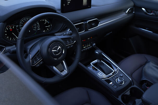 the wheel and dashboard of a 2022 CX-5 2.5 Turbo Signature