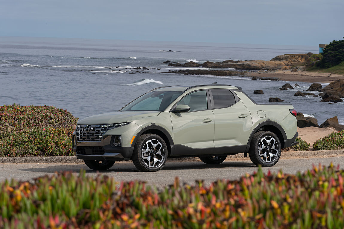 a green 2022 hyundai santa cruz driving