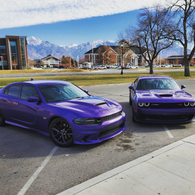 A Dodge Charger next to a Dodge Challenger