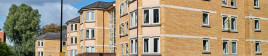 Orange brick apartment buildings in a city