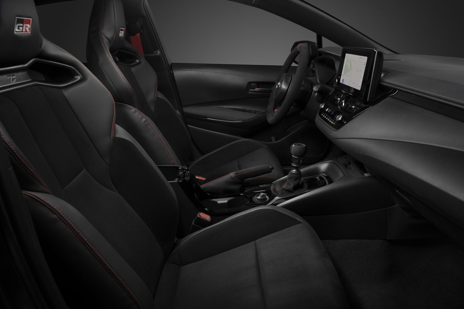 the seats, wheel, and dashboard of a 2023 GR Corolla Morizo Edition