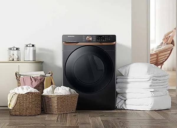 A black dryer with laundry in one room