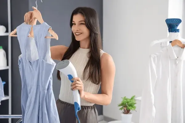 pretty-young-woman-steaming-clothes-600nw-2540212549