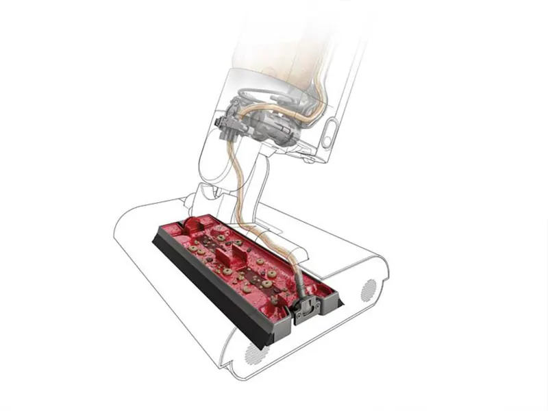 Une vue en coupe de l’appareil montrant son système interne de gestion des déchets