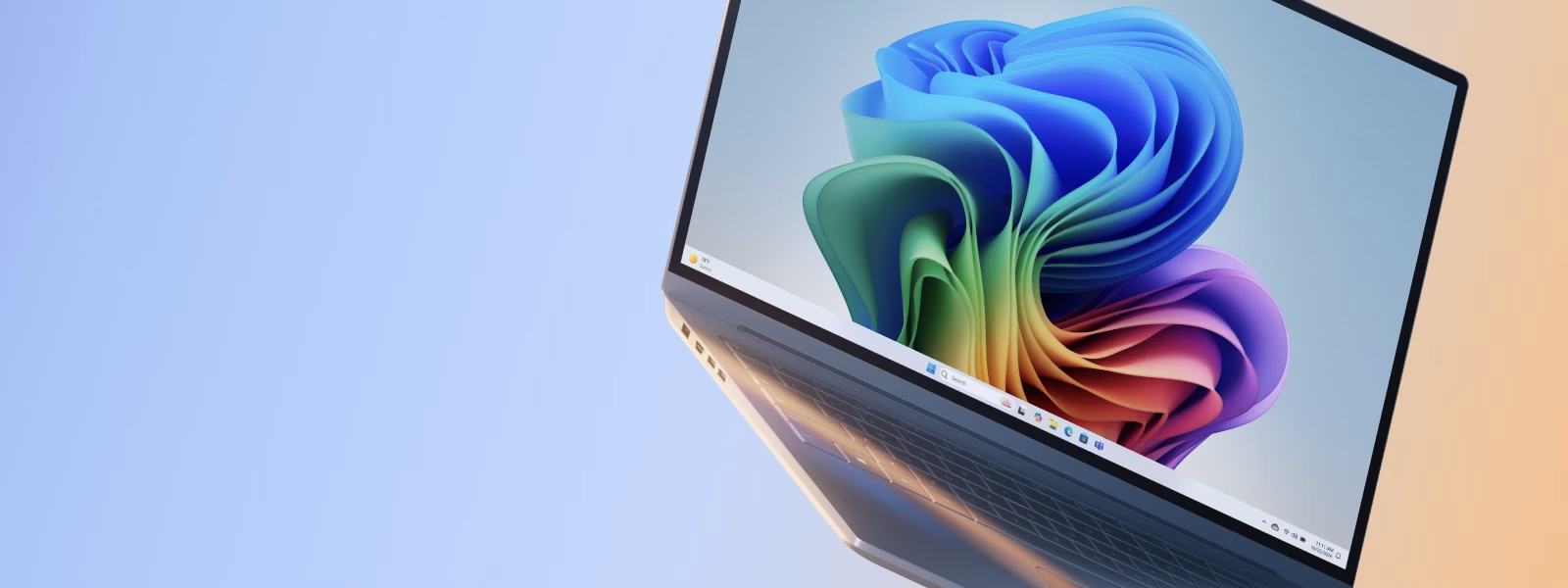 MSFT-Windows-PC-with-rainbow-bloom-blue-orange-gradient-background-1600X600