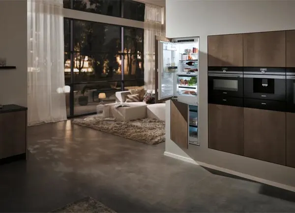 A built-in refrigerator in a room.