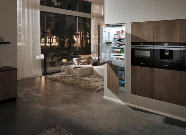 A built-in refrigerator in a room.